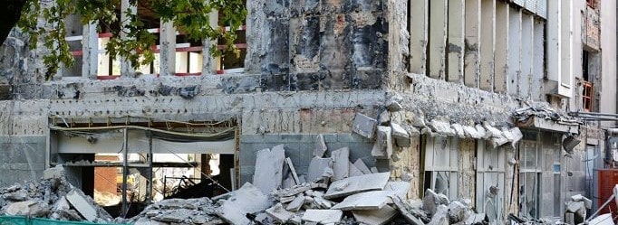 Building destroyed by earthquake - earthquake insurance
